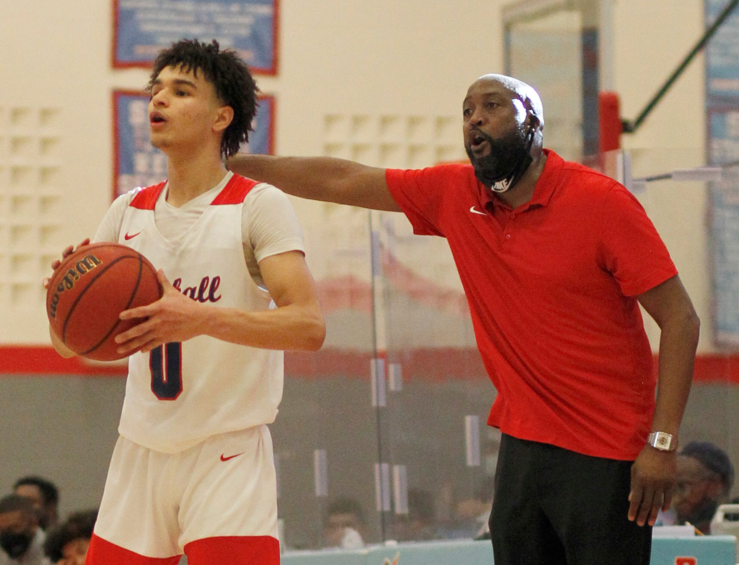 Dallas Kimball head coach Nick Smith directs his players as Knights guard Jayden Blair (0O...