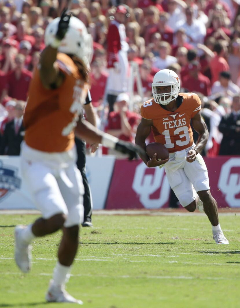 Texas quarterback Jerrod Heard carries against Oklahoma. (Andy Jacobsohn/The Dallas Morning...