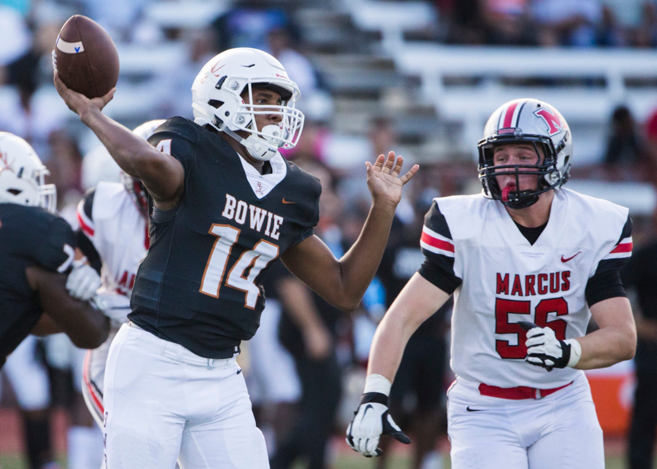 Arlington Bowie quarterback Drevvon Ponder (14) throws  a pass ahead of Flower Mound Marcus...