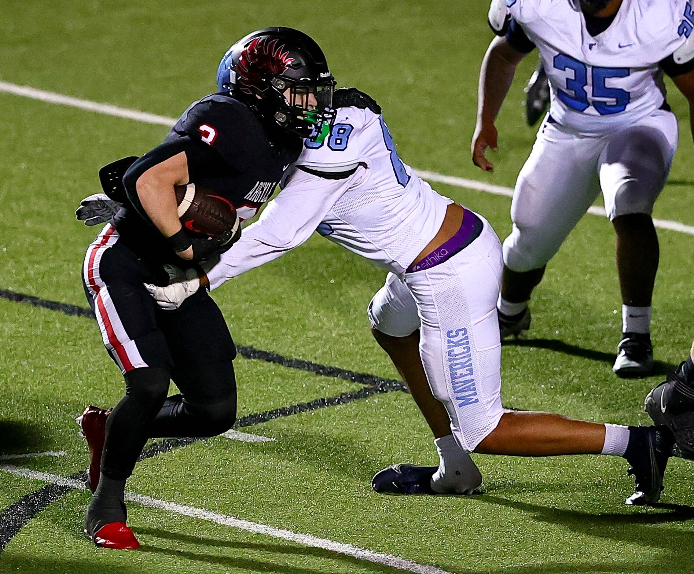 Argyle running back Jake Krekeler (3) tries to avoid Frisco Emerson defensive lineman Keiton...