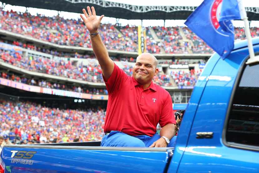 ARLINGTON, TX - AUGUST 12: Ivan (Pudge) Rodriguez waves to the crowd after his #7 jersey is...