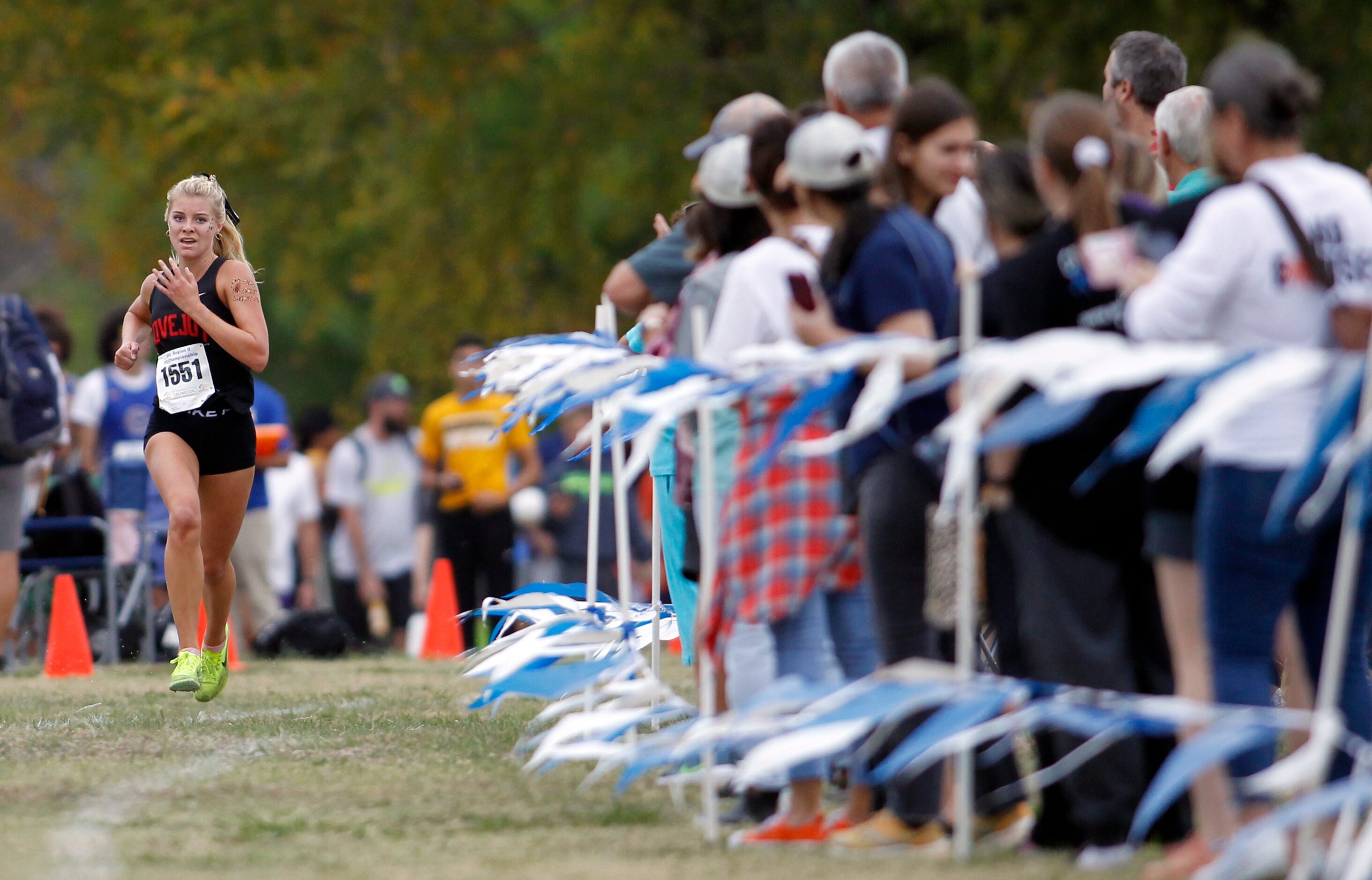 Lucas Lovejoy senior Sara Morefield (1551) races to the finish line with a winning time of...