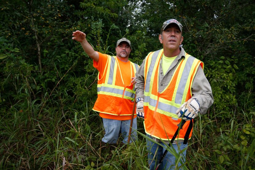 Robert O'Neil (left) and Mark Morris, the father of Christina Morris, search for Christina...