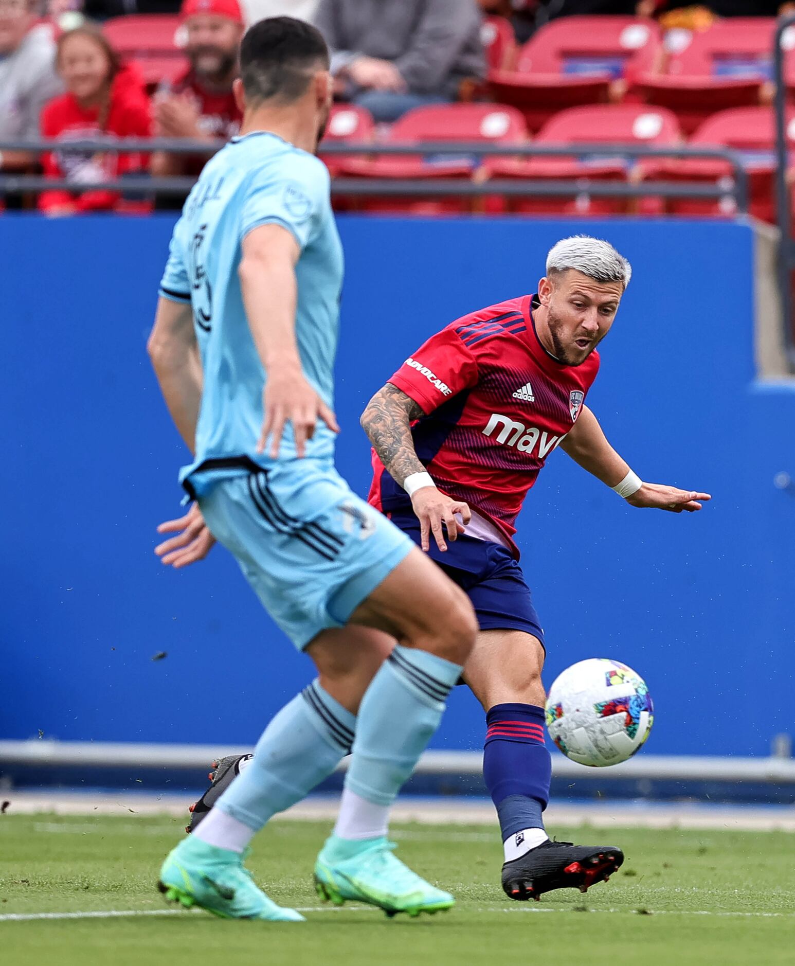 FC Dallas Paul Arriola (right) attempts a shot on goal against Minnesota United defender...