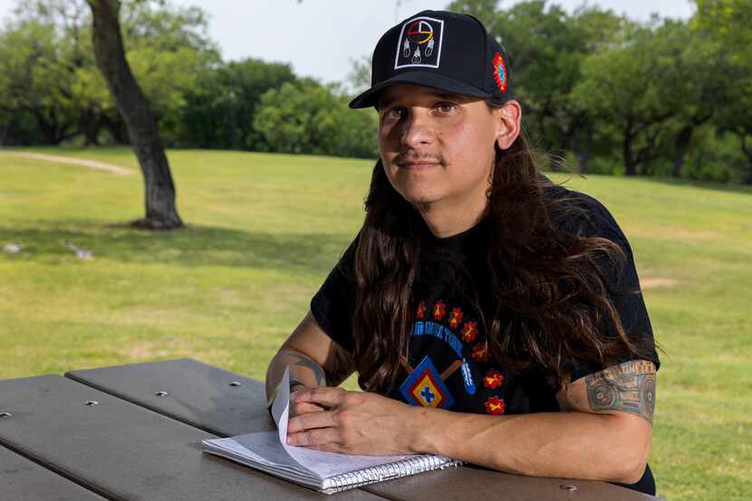 Stephen Silva Brave poses for a portrait with his notebook at Turner Park in Grand Prairie,...