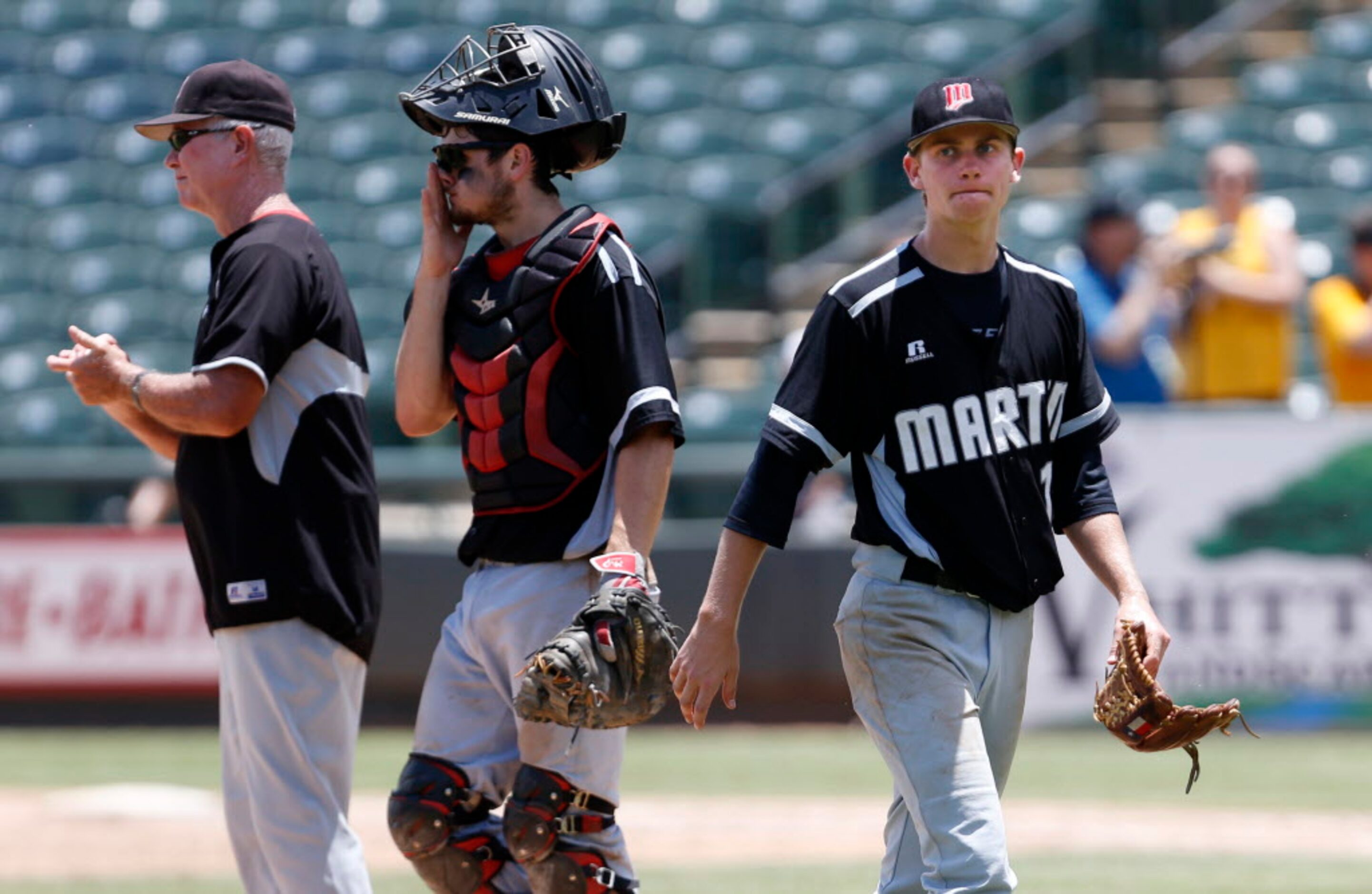 Martin's Nick Skeffington (15) makes his way to the dugout after being pulled from the game...