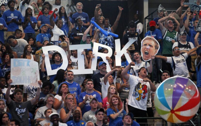 Fans cheer for the Mavericks during the watch party at the American Airlines Center in...