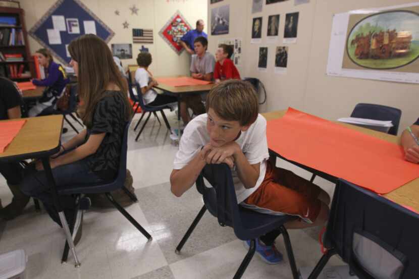 Alex Austin, 14, listens to Cristi Derow's eighth-grade American history class at Forestwood...