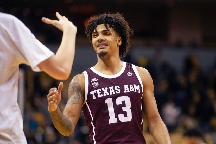 Texas A&M's Brandon Mahan is congratulated by teammates after they defeated Missouri 68-59...