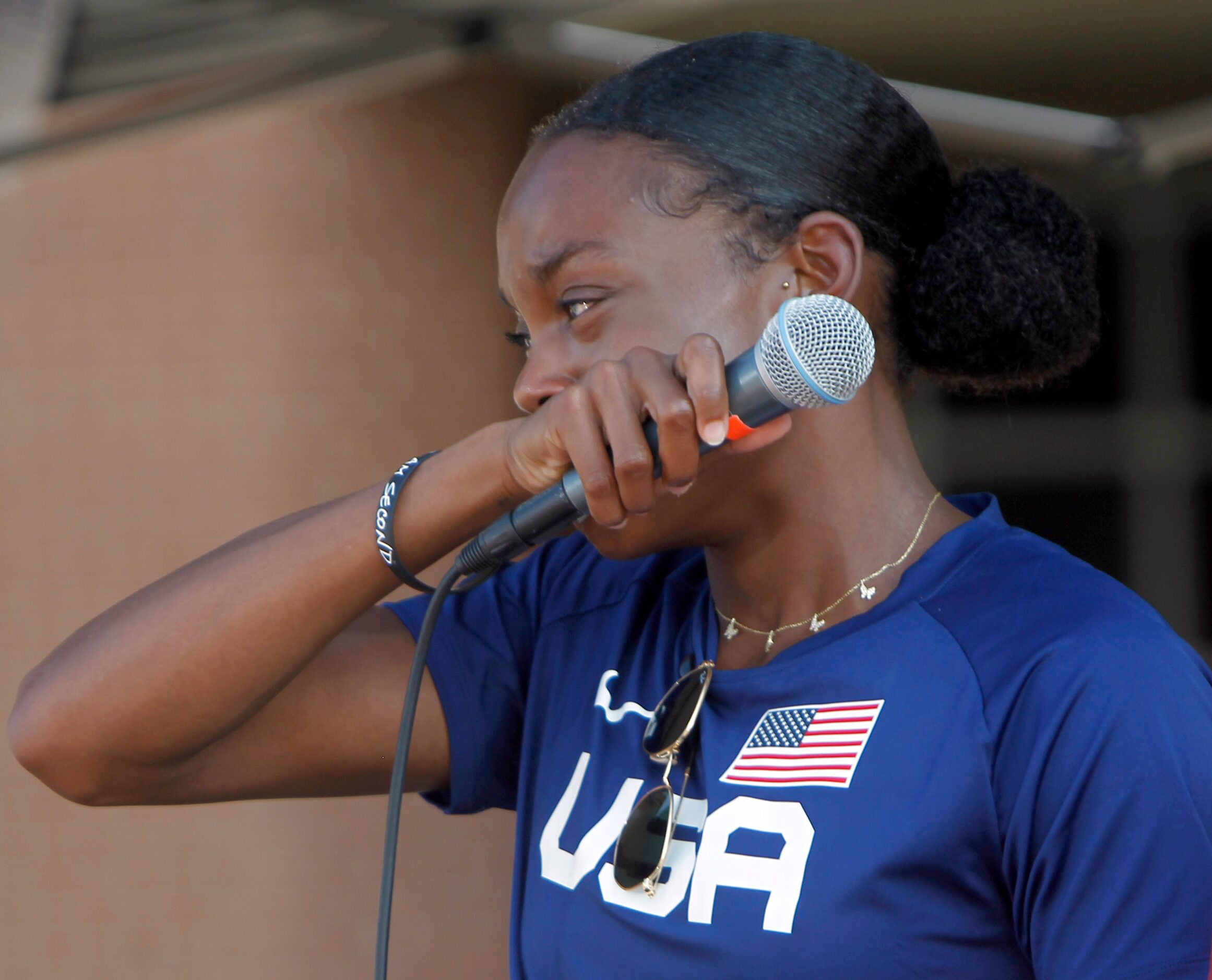 An emotional Jasmine Moore pauses while speaking about given the opportunity to represent...