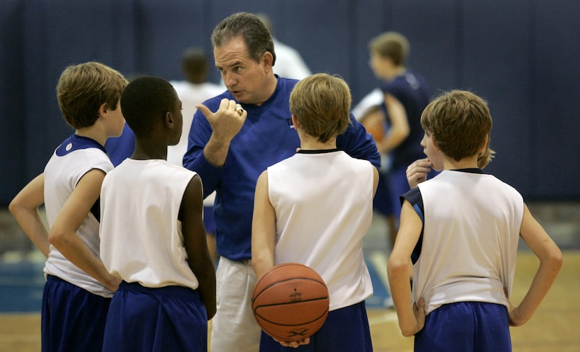 Texas Titans head coach Scott Pospichal talks with players on the program's AAU third grade...