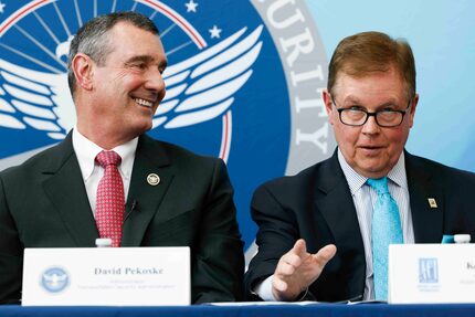 Transportation Security Administration administrator David Pekoske, left, smiles as he...