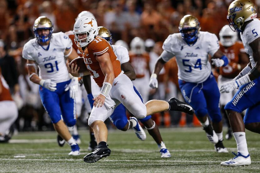 AUSTIN, TX - SEPTEMBER 08:  Sam Ehlinger #11 of the Texas Longhorns scrambles in the fourth...