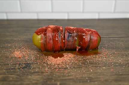 The Chamoy! Pickle at the State Fair of Texas in 2022 is wrapped and stuffed with fruit...