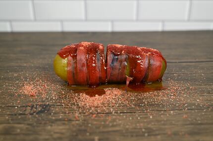 The Chamoy! Pickle at the State Fair of Texas in 2022 is wrapped and stuffed with fruit...