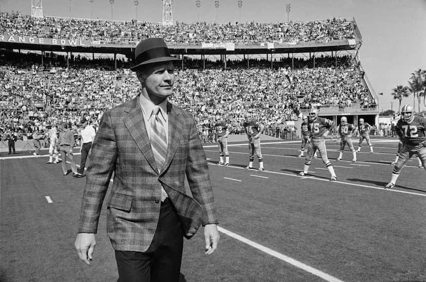 Dallas Cowboys coach Tom Landry walks across the turf at the Orange Bowl, Jan. 17, 1971, as...