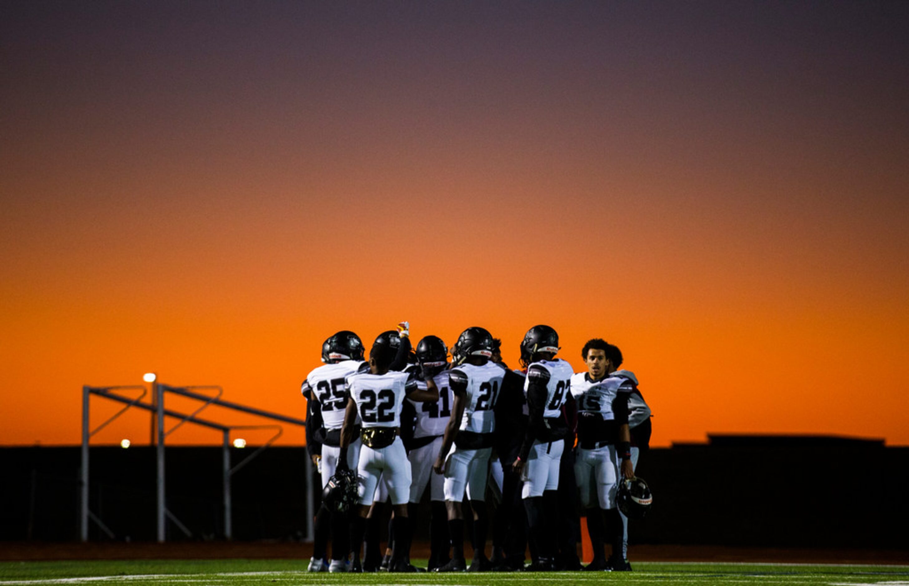 Mansfield Timberview football players gather before a UIL Class 5A Division I first-round...