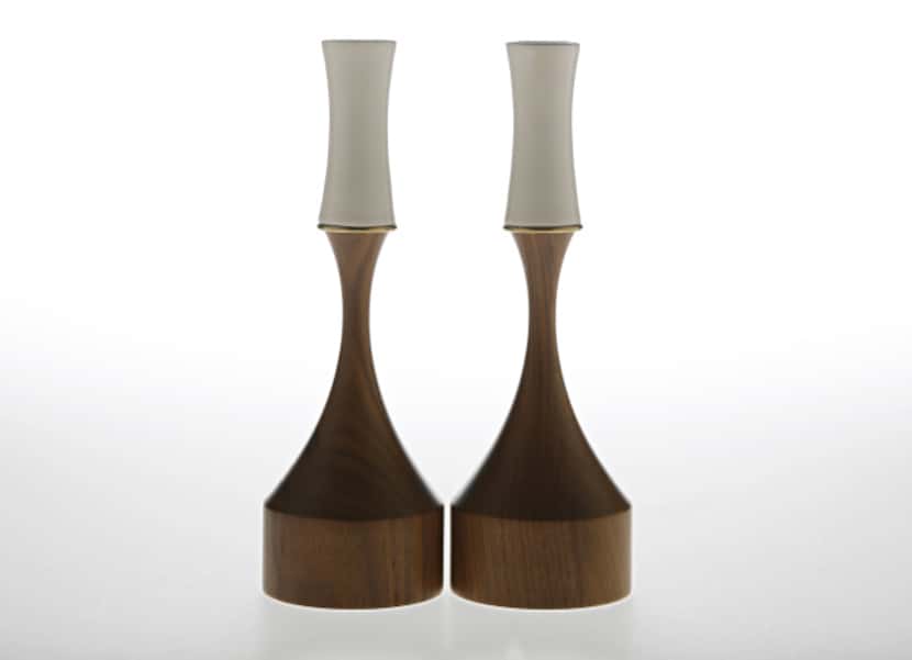 Bring a midcentury touch to the table with a pair of porcelain candleholders on walnut bases...