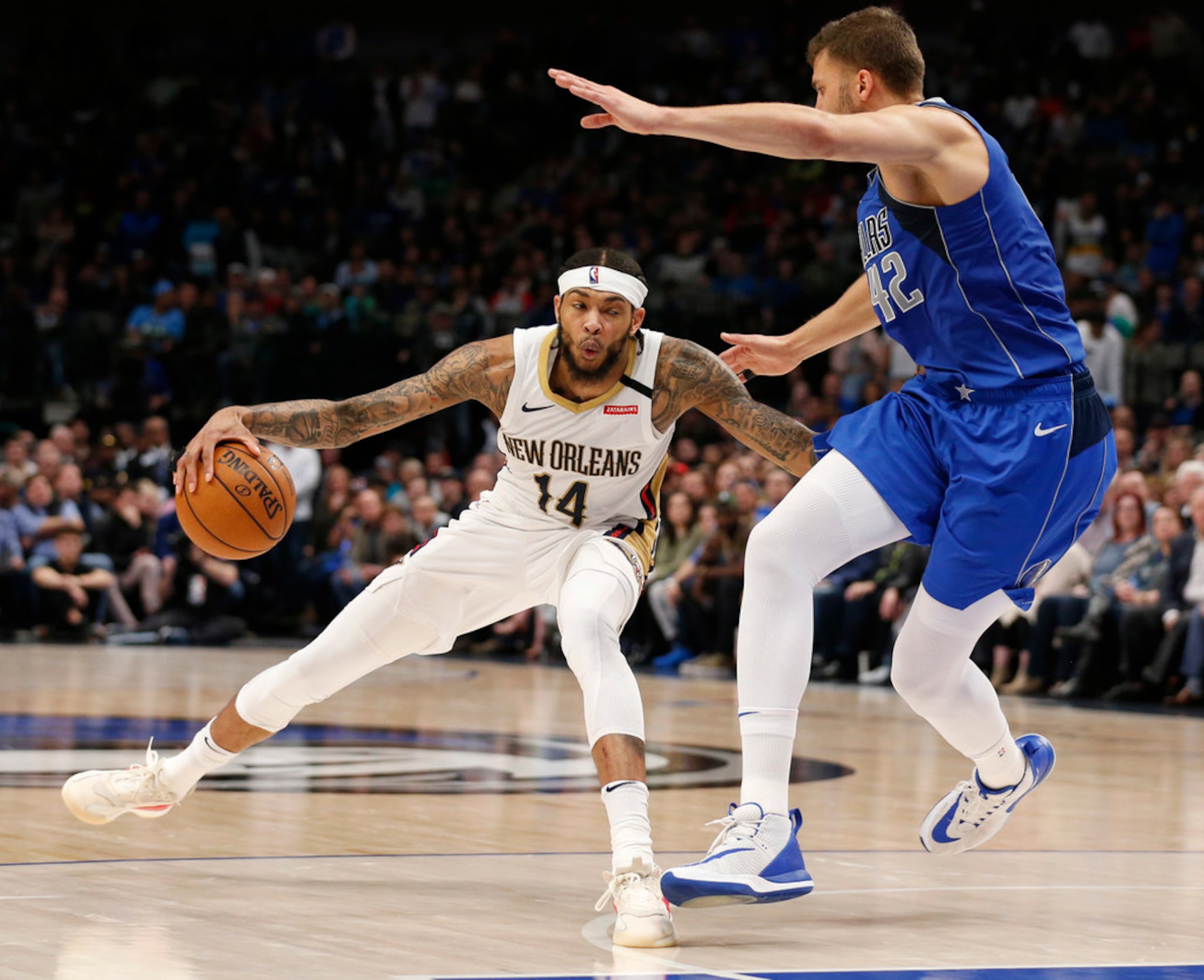 New Orleans Pelicans forward Brandon Ingram (14) steps back as Dallas Mavericks forward Maxi...