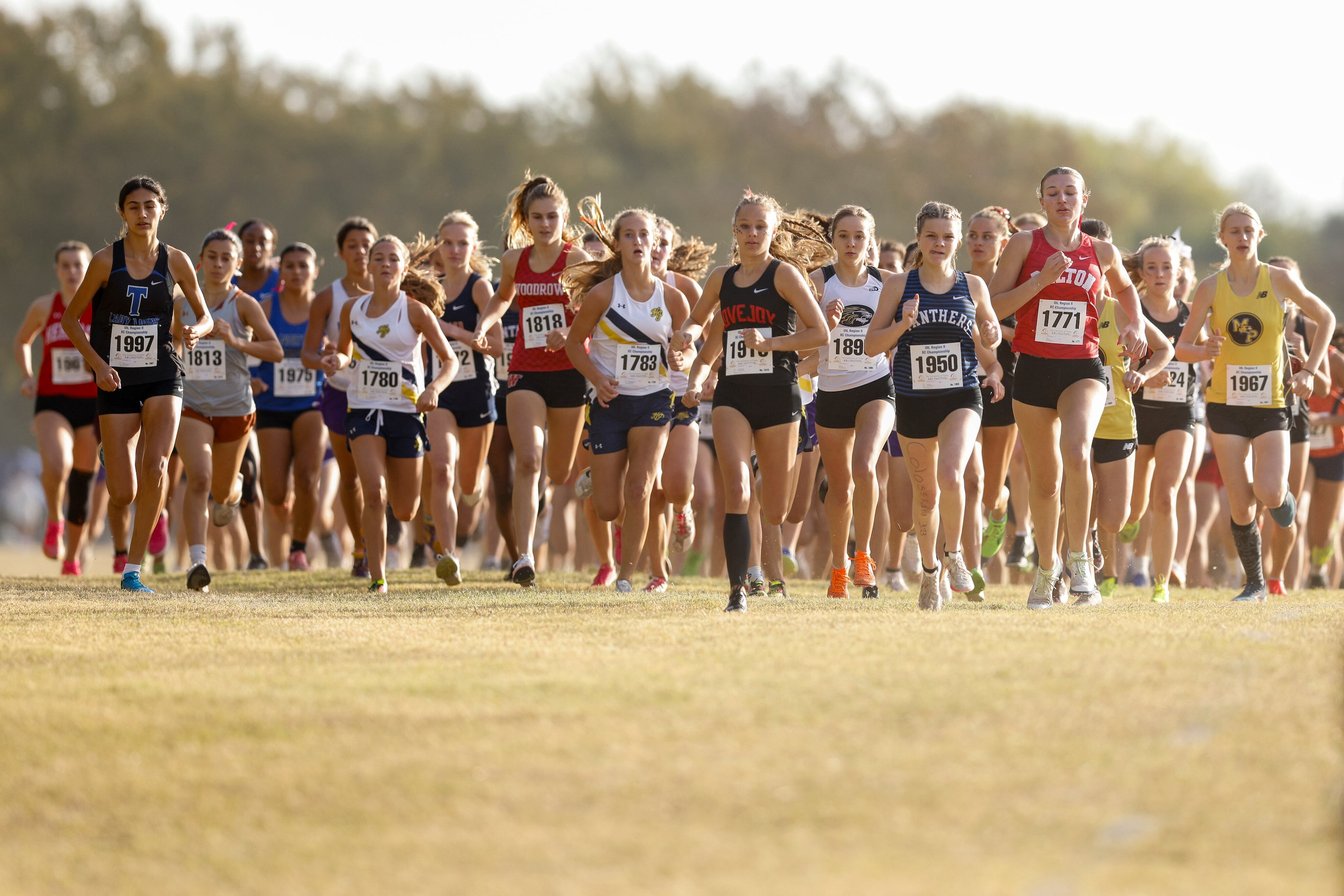 The field makes its way down the starting straight during the girls UIL Class 5A Region II...