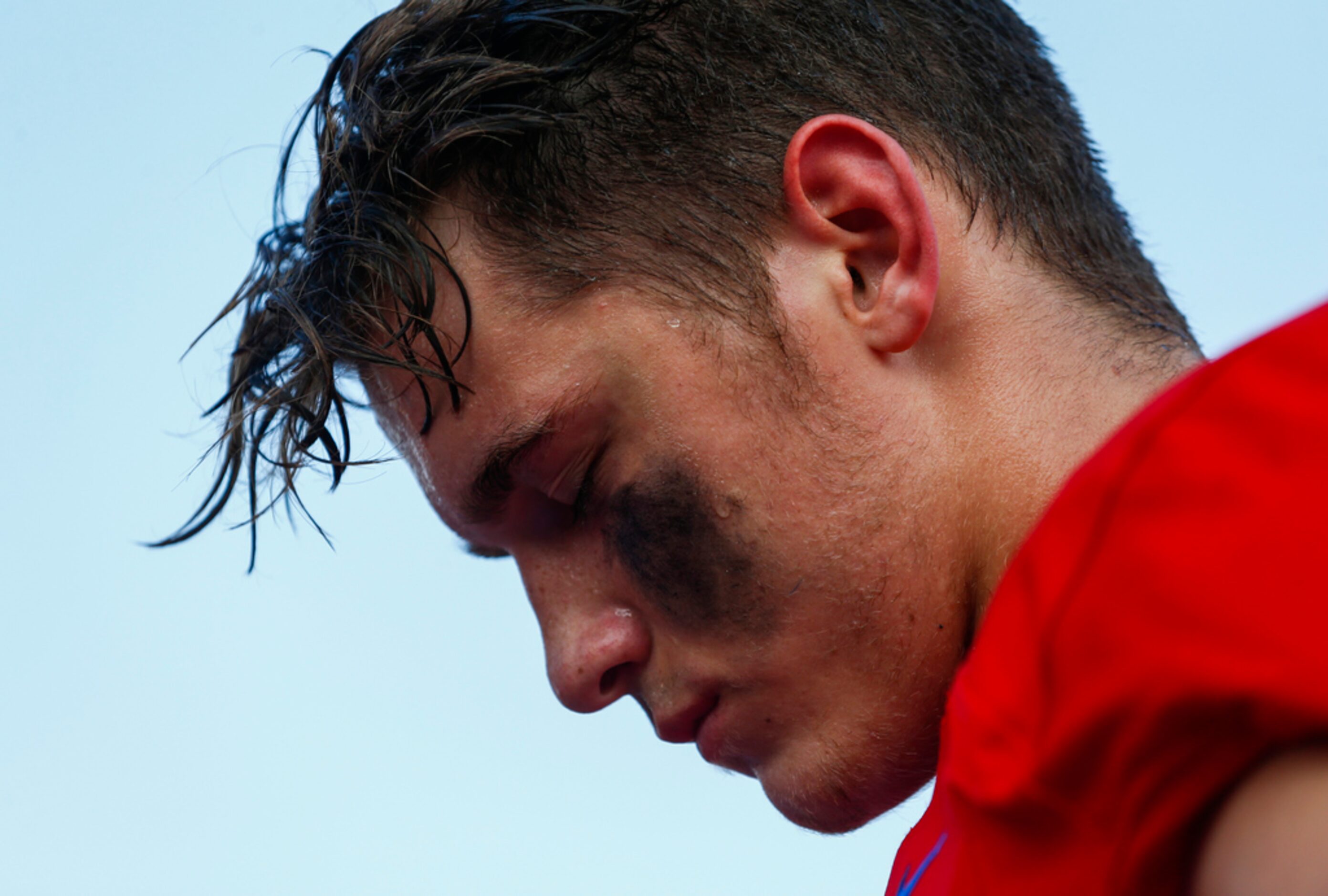 Parish Episcopal quarterback Preston Stone takes a moment prior to a high school football...