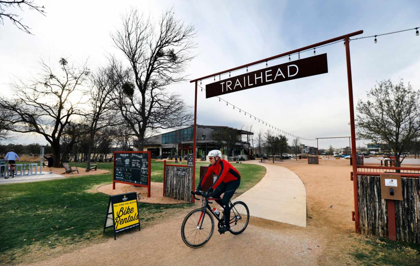 A cyclist enters the Trinity Trails at The Trailhead at Clearfork event area near Press Cafe...