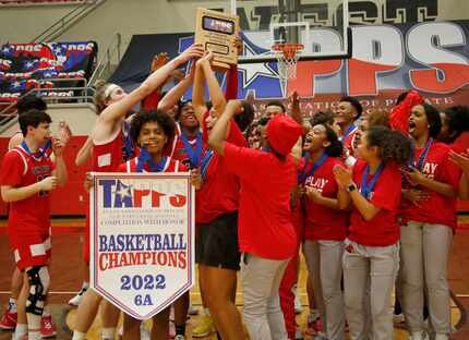 Members of the Plano John Paul ll boys and girls teams celebrate after both won state 6A...
