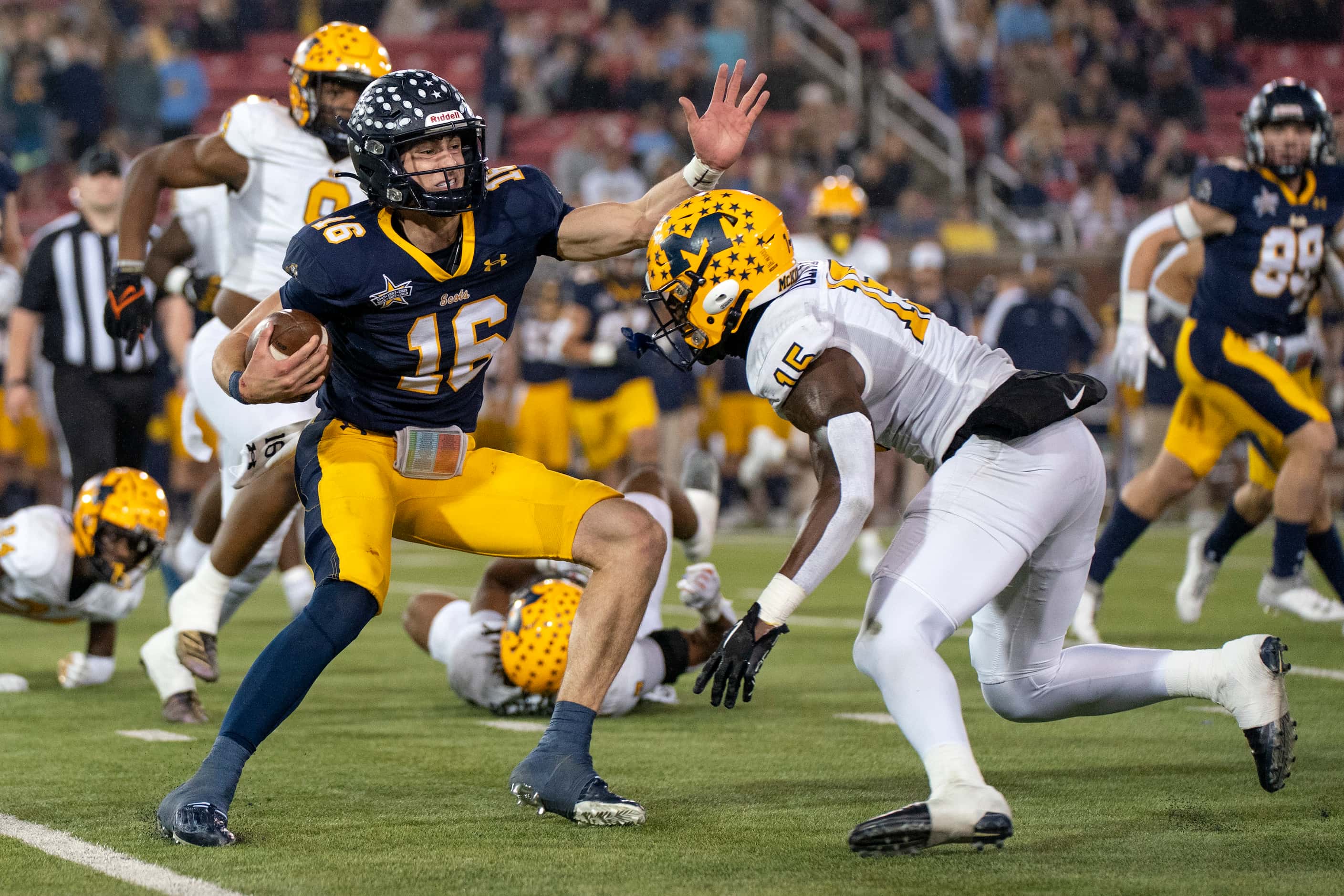 Highland Park senior quarterback Parker Thompson (16) tries unsuccessfully to avoid the...