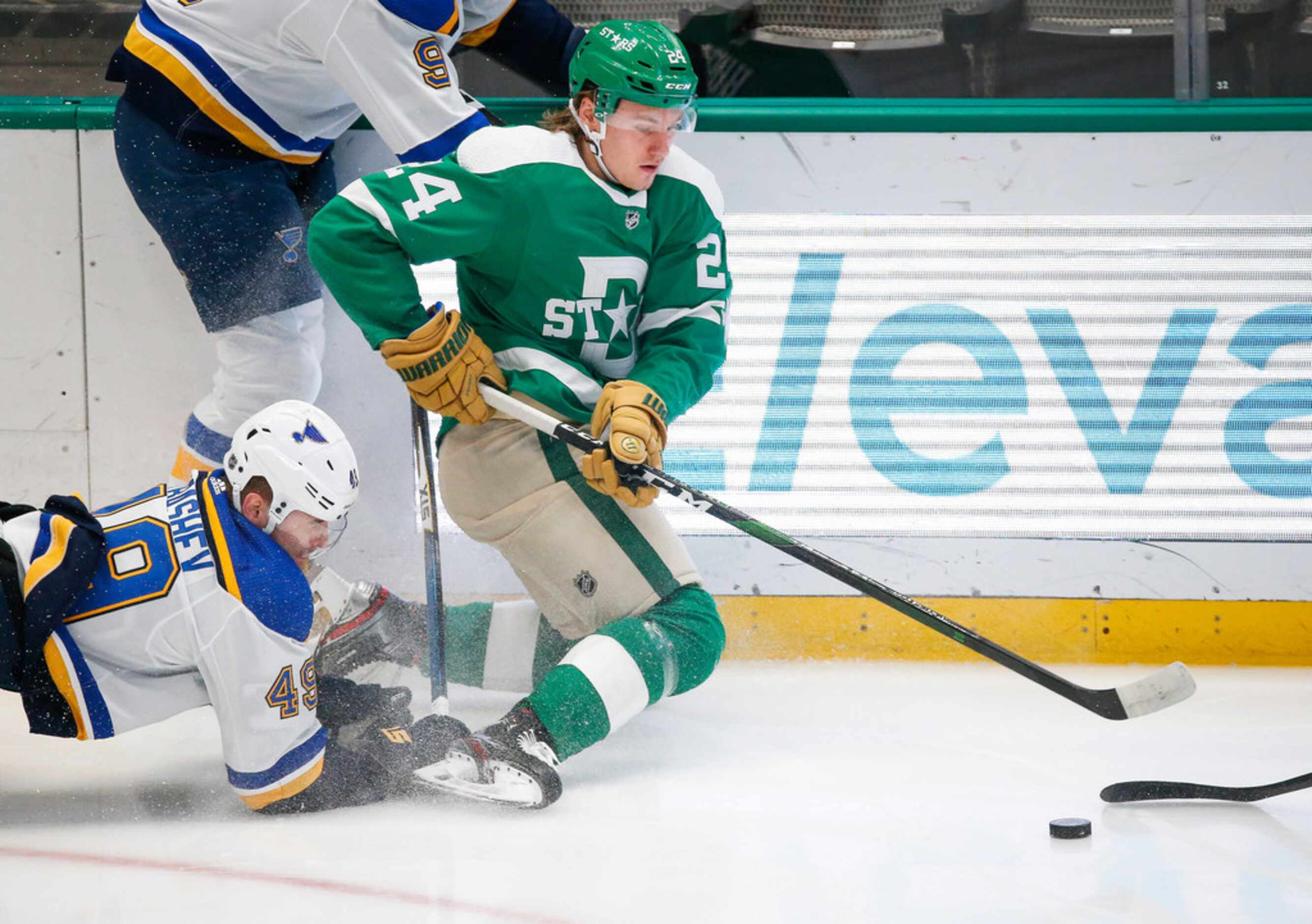 Dallas Stars left wing Roope Hintz (24) and St. Louis Blues center Ivan Barbashev (49)...