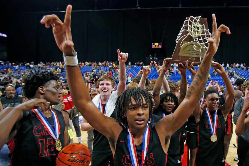 Lake Highlands players celebrate a 55-44 win over Beaumont United in the Class 6A state...