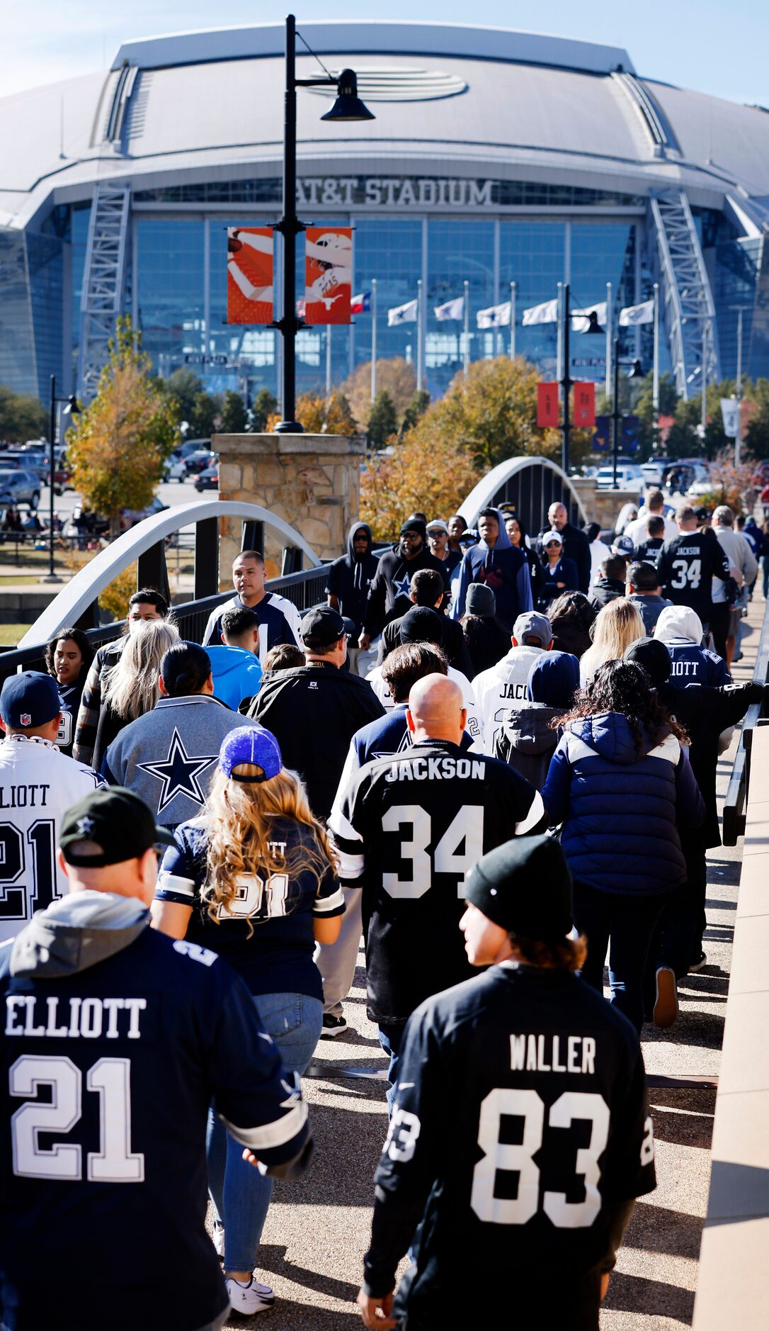 Dallas Cowboys and Las Vegas Raiders fans arrive for the Thanksgiving Day game at AT&T...