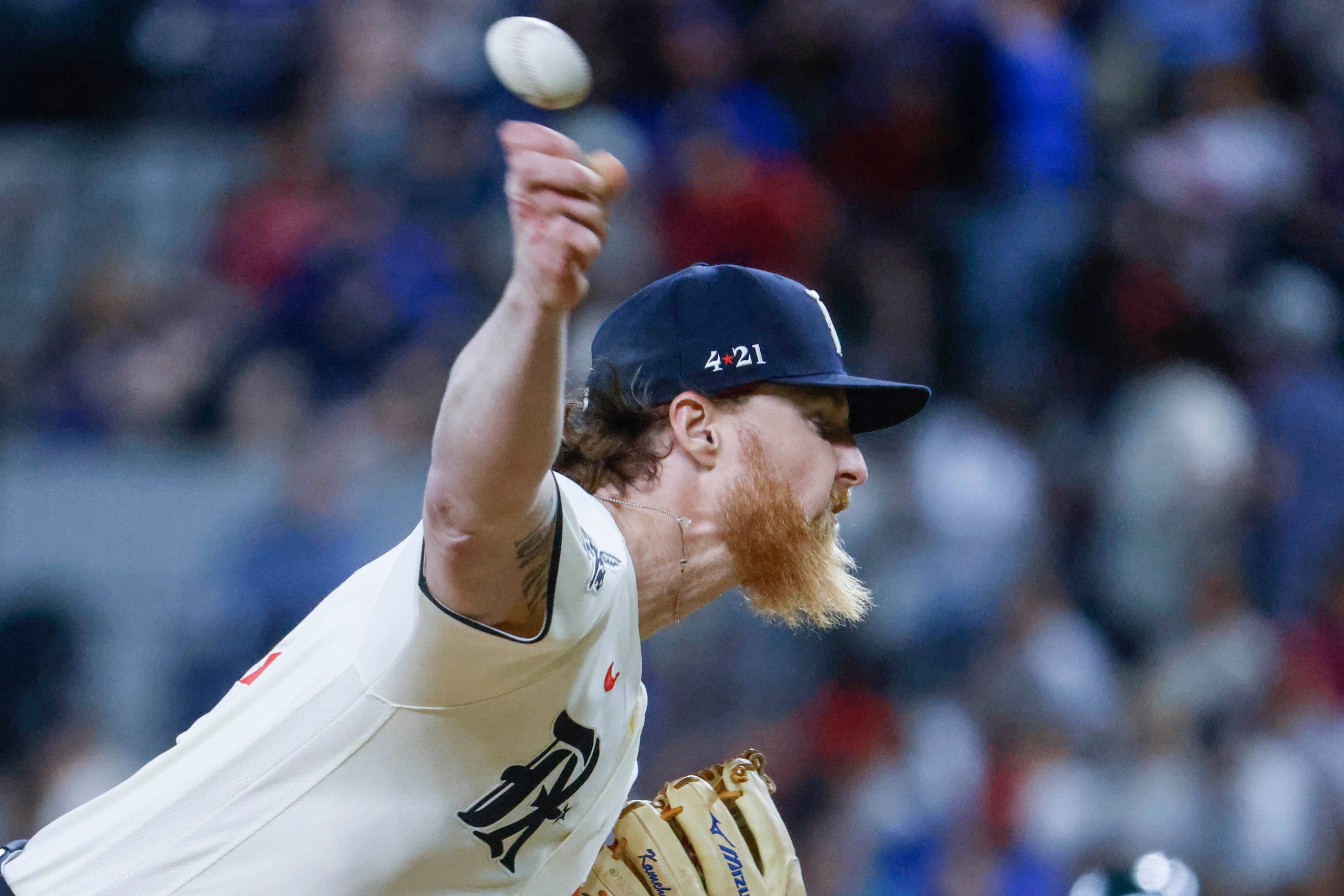 Texas Rangers starting pitcher Jon Gray throws during the third inning of a baseball game...