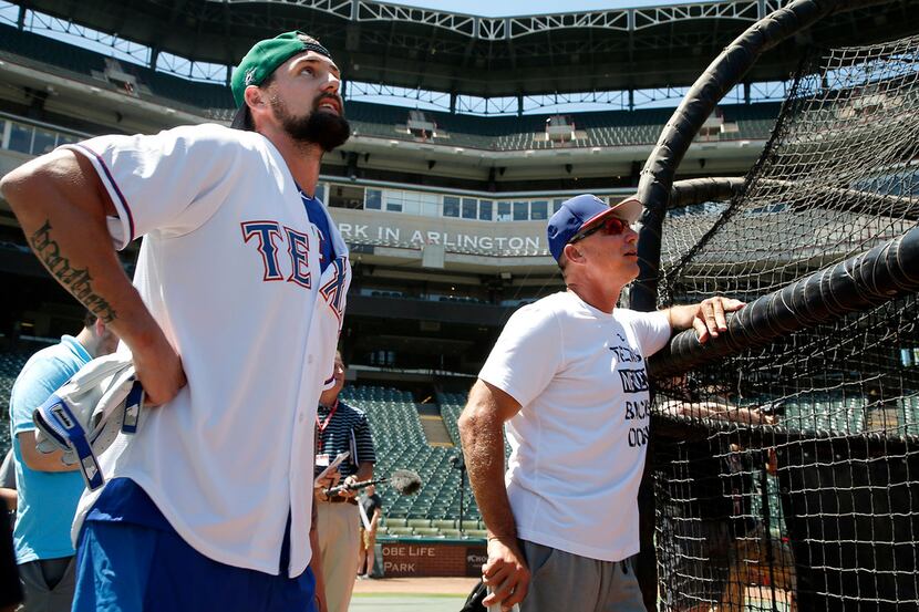 Dallas Stars captain Jamie Benn, left, and Texas Rangers manager Jeff Banister watch as...