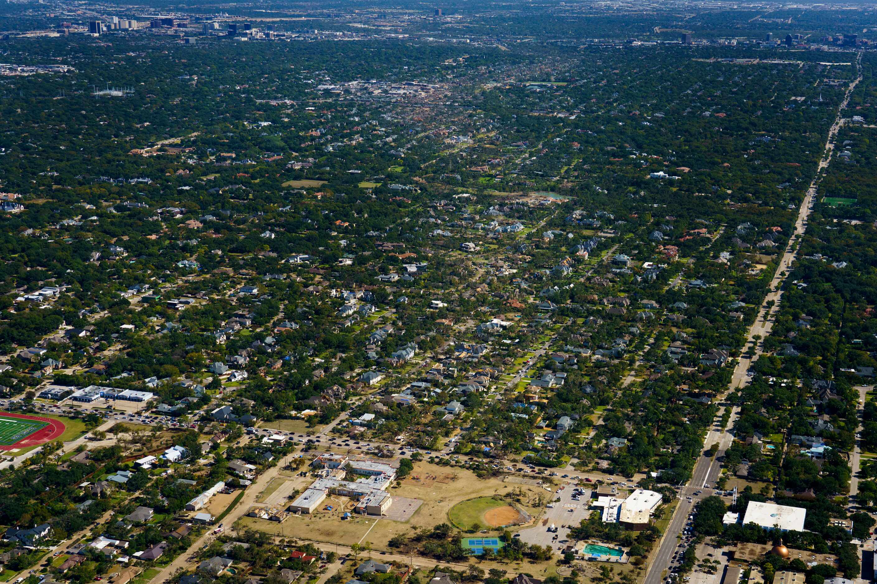 The path of tornado damage is seen stretching northeast from the Walnut Hill Recreation...