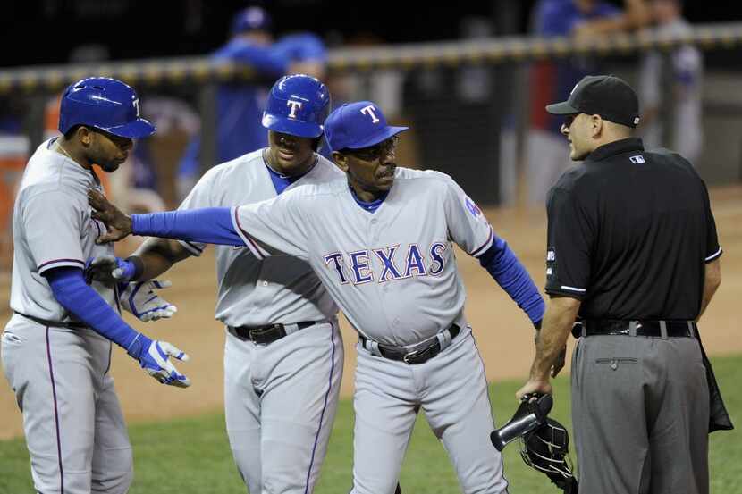 MINNEAPOLIS, MN - MAY 28: Adrian Beltre #29 and manager Ron Washington #38 of the Texas...