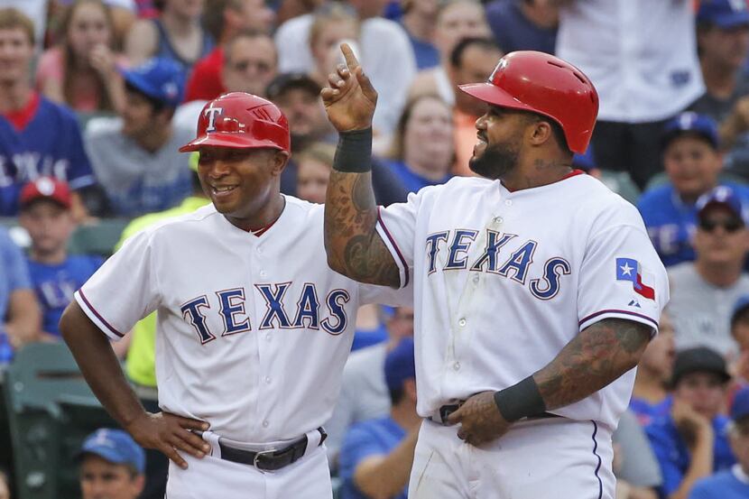 Texas Rangers designated hitter Prince Fielder (84), right, tells Texas Rangers third base...