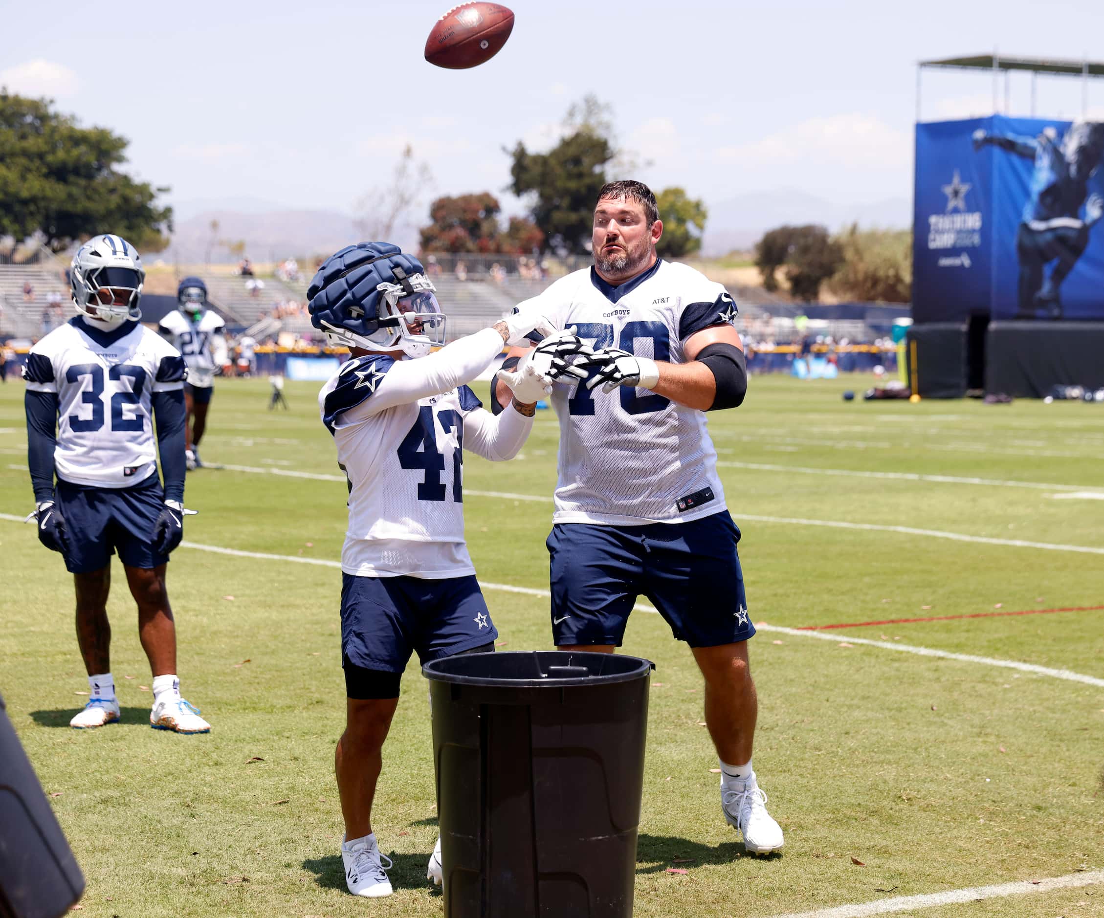 Dallas Cowboys guard Zack Martin (70), one of the largest players on the team, jumps in to...