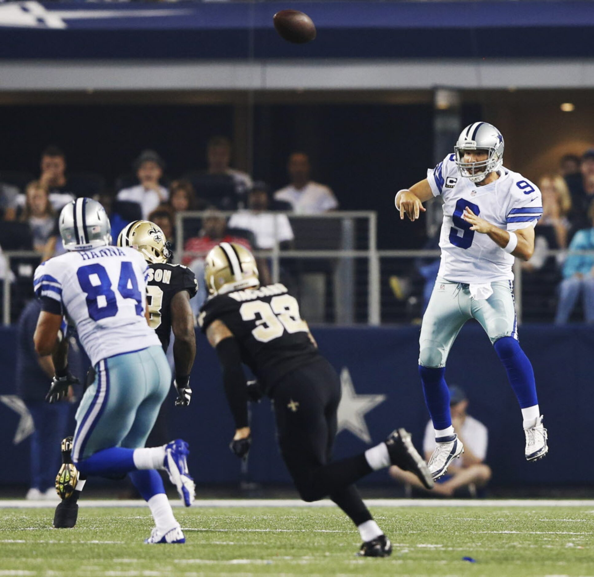 Dallas Cowboys quarterback Tony Romo (9) leaps to make a pass attempt to Dallas Cowboys...