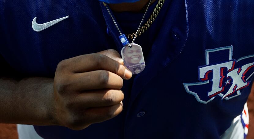 Texas Rangers minor league picture, Demarcus Evans wears a dog tag with a picture of his...