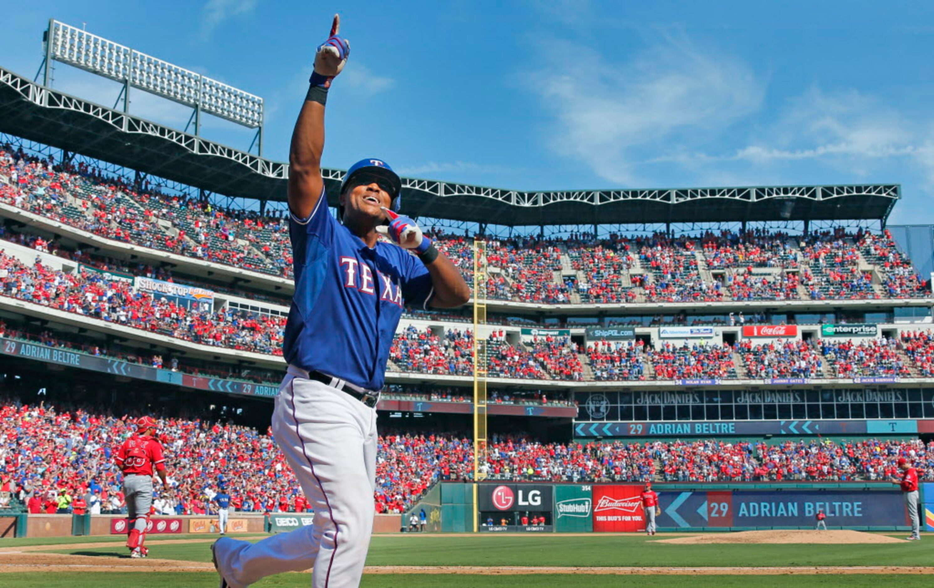 Texas Rangers third baseman Adrian Beltre (29) gestures to the crowd after hitting a two-run...