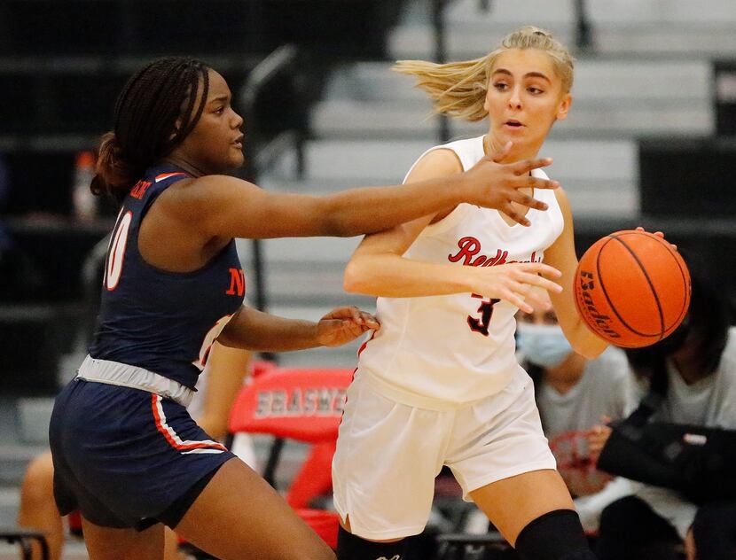 Frisco Liberty High School guard Lily Ziemkiewicz (3) looks to pass while defended by...