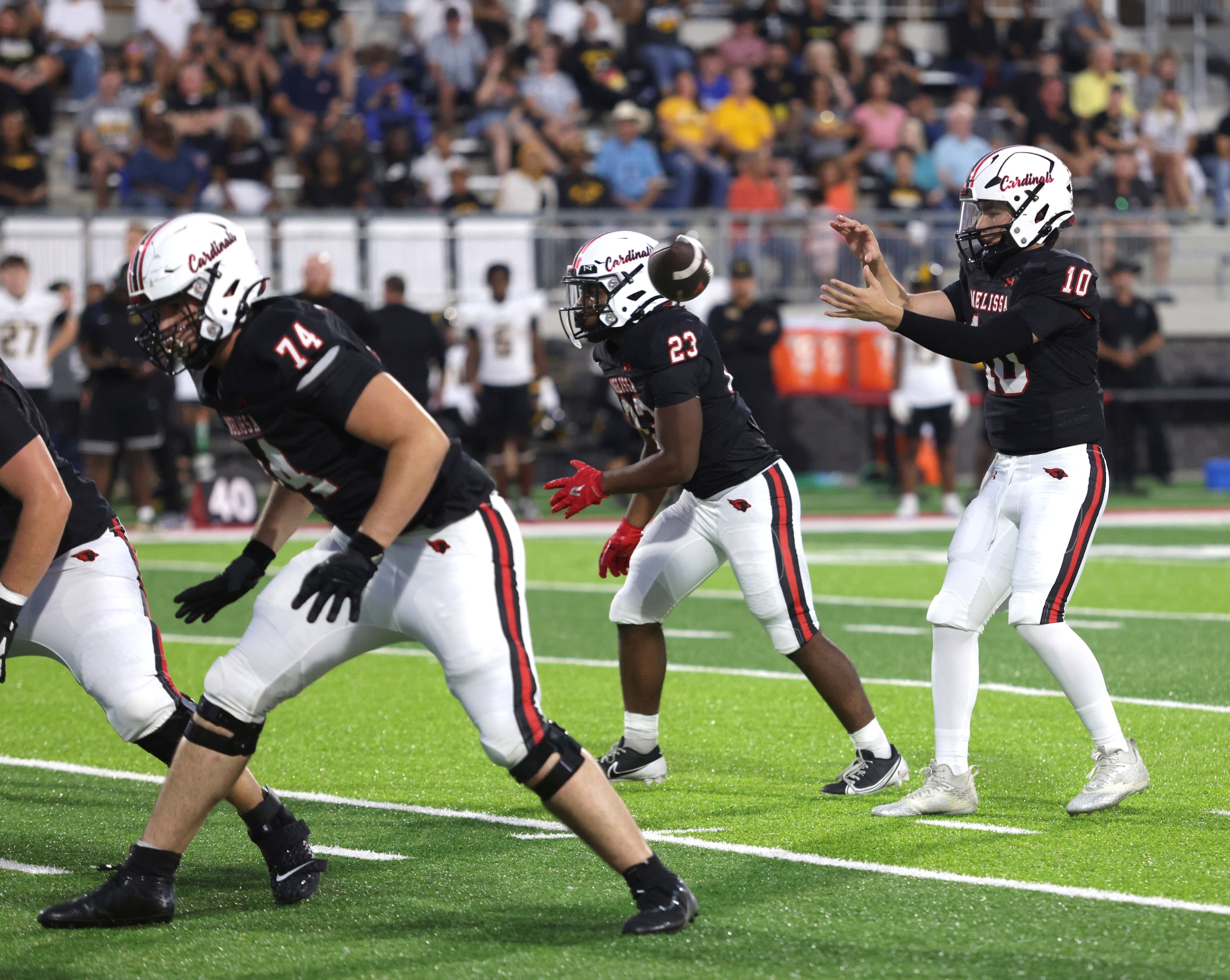 Melissa player #10 Noah Schuback receives the snap during the Frisco Memorial High School at...