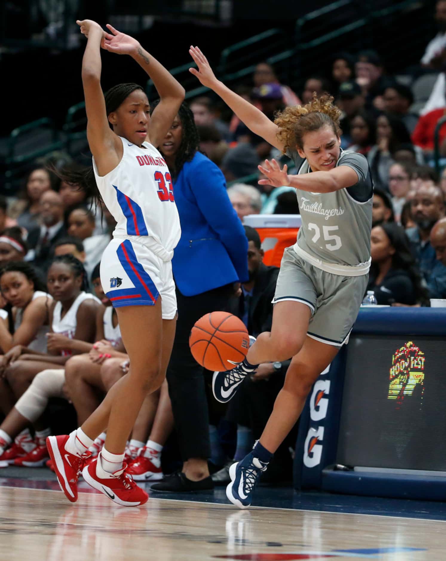 Duncanville's Nyah Wilson (33) fouls Sierra Canyon's Ashley Chevalier (25) during their high...