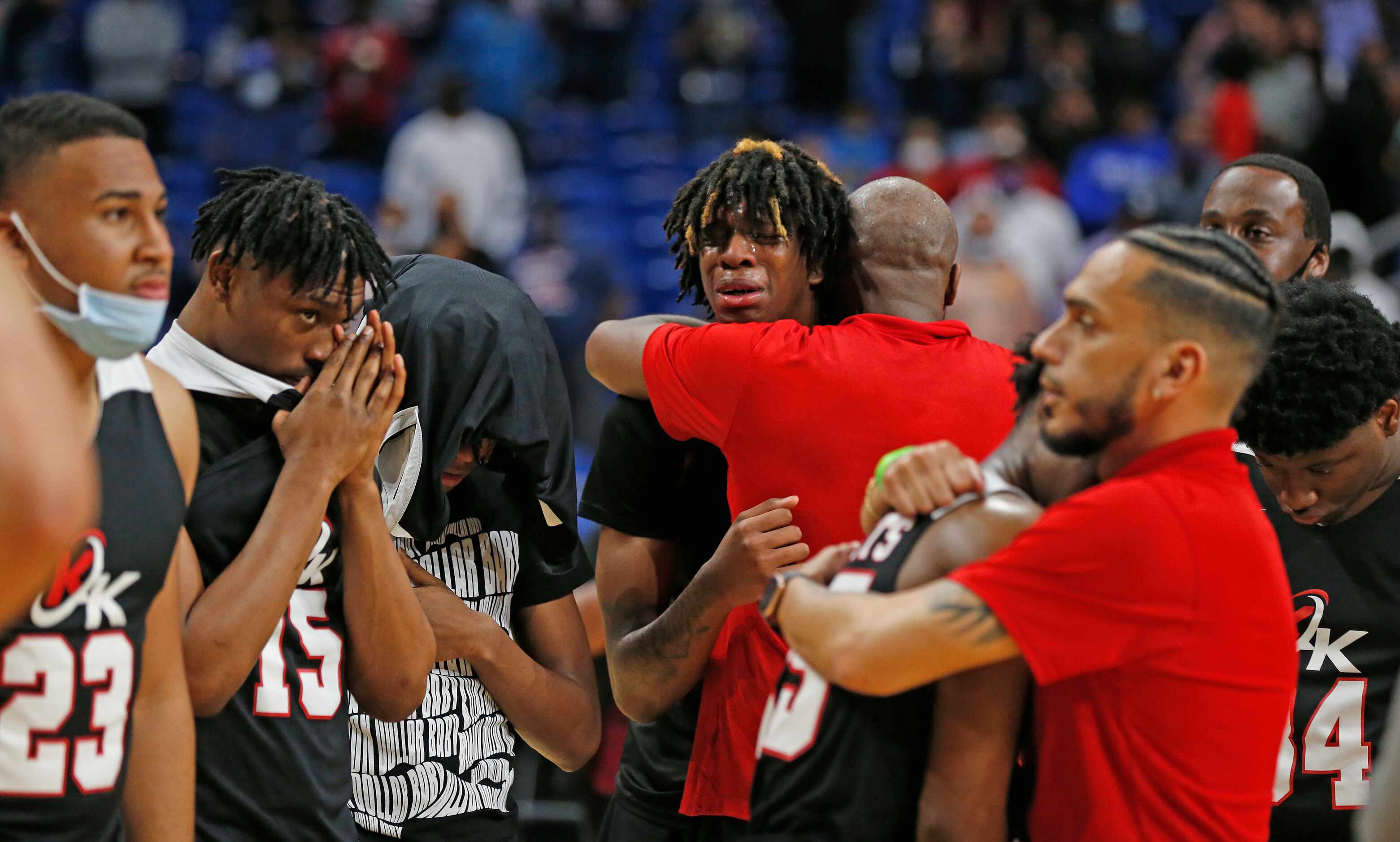 Kimbal players react after losing in OT to Beaumont. UIL boys Class 5A basketball state...