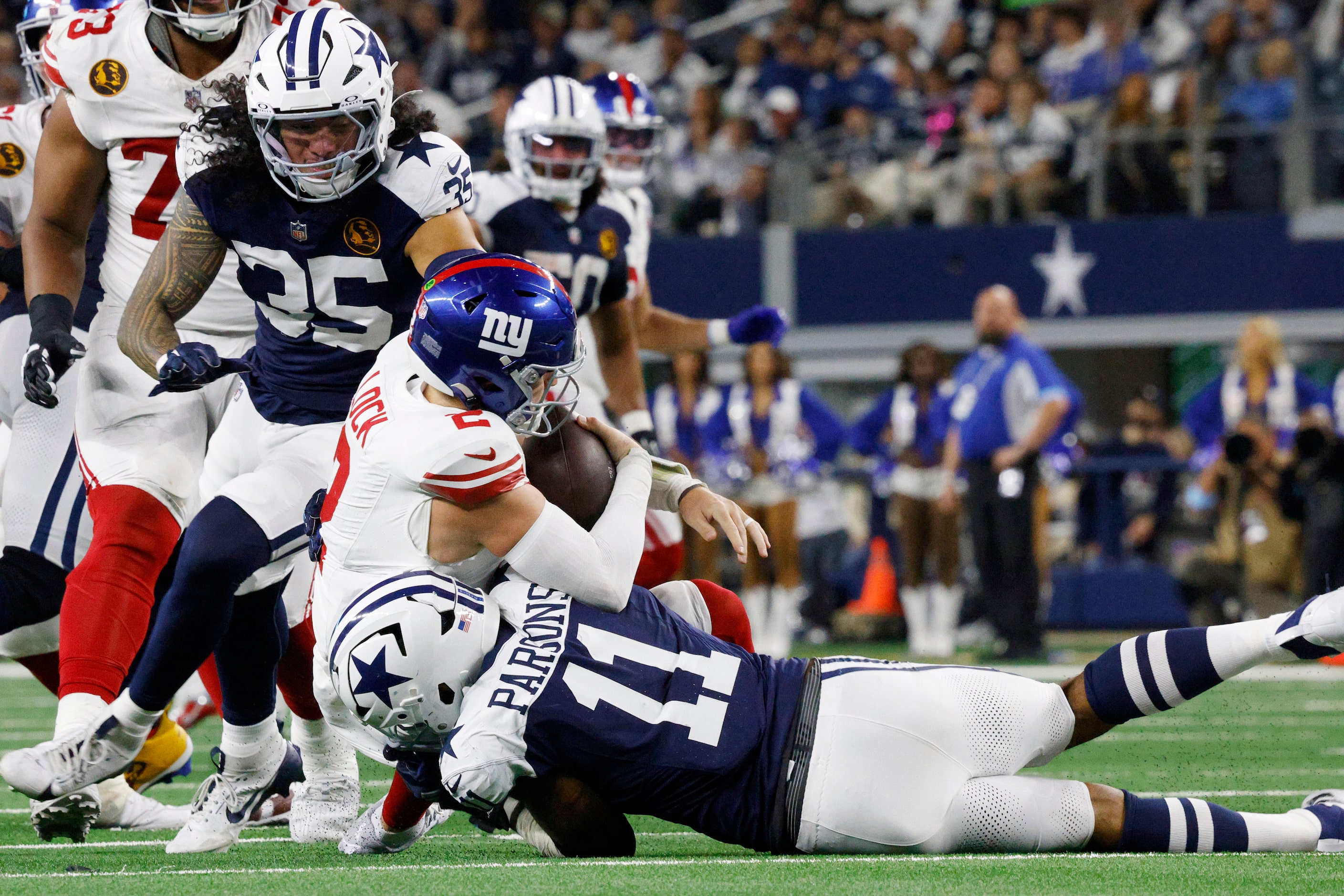 New York Giants quarterback Drew Lock (2) is sacked by Dallas Cowboys linebacker Marist...