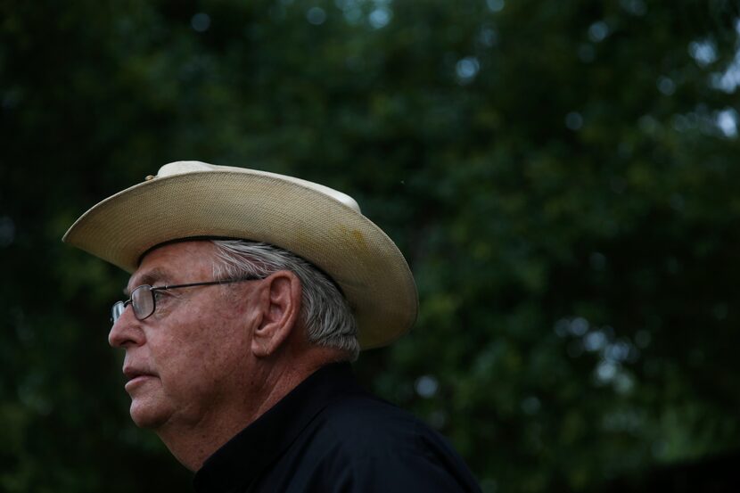 Father Roy Snipes looks toward the Rio Grande before going out for a boat ride near Mission.