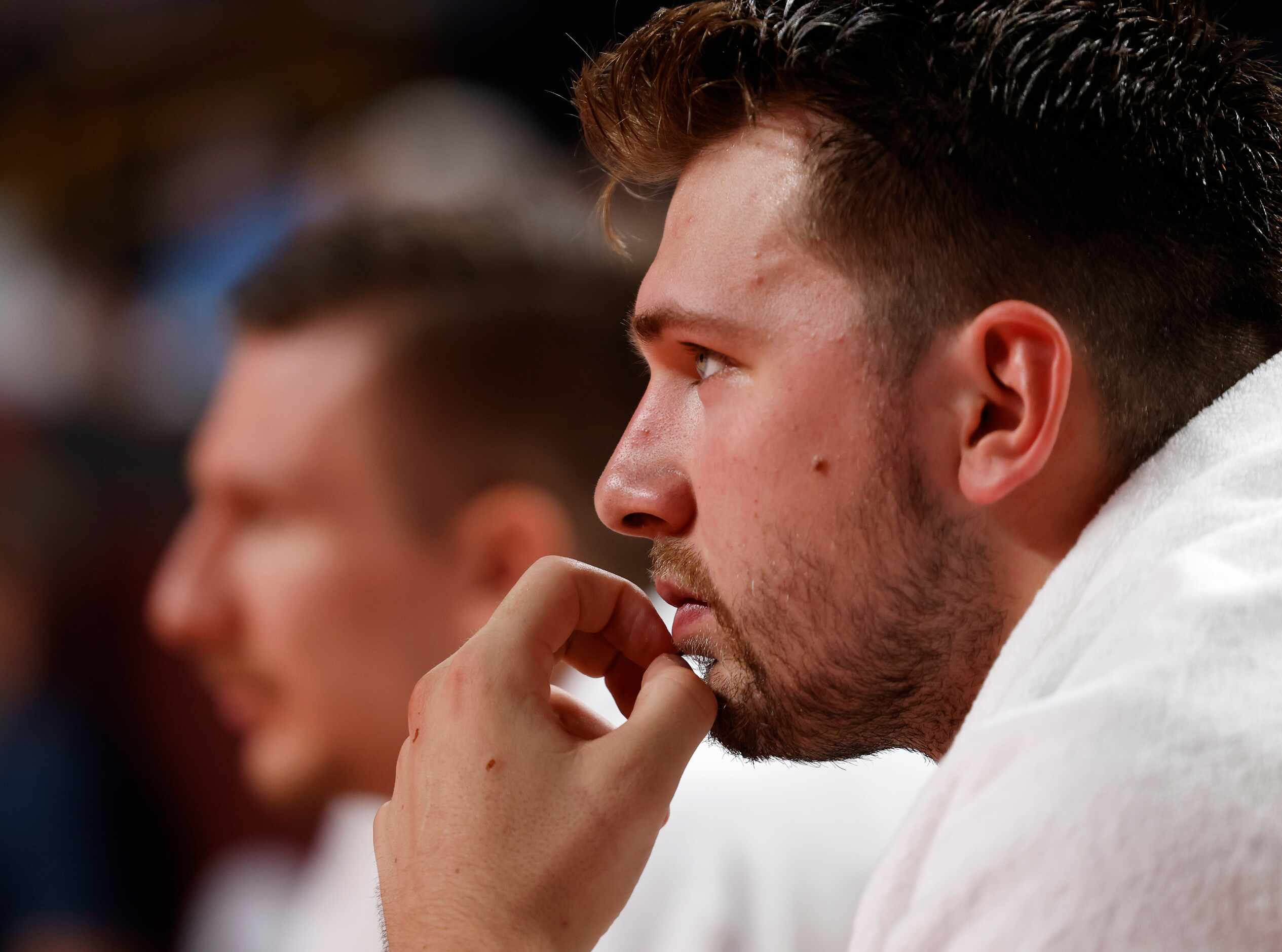 Slovenia’s Luka Doncic (77) watches the basketball game against Japan  from the bench during...