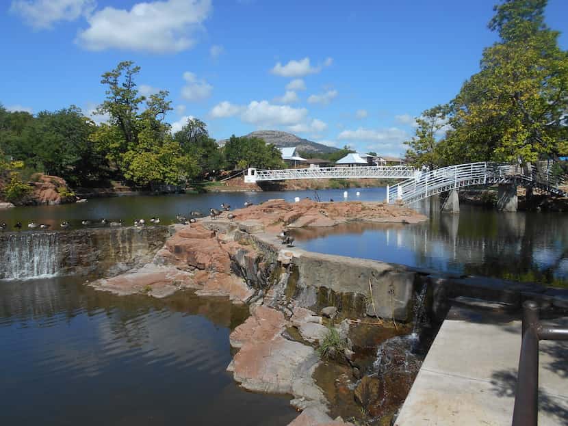 The river walk in downtown Medicine Park features a series of spillways dotted by parks and...