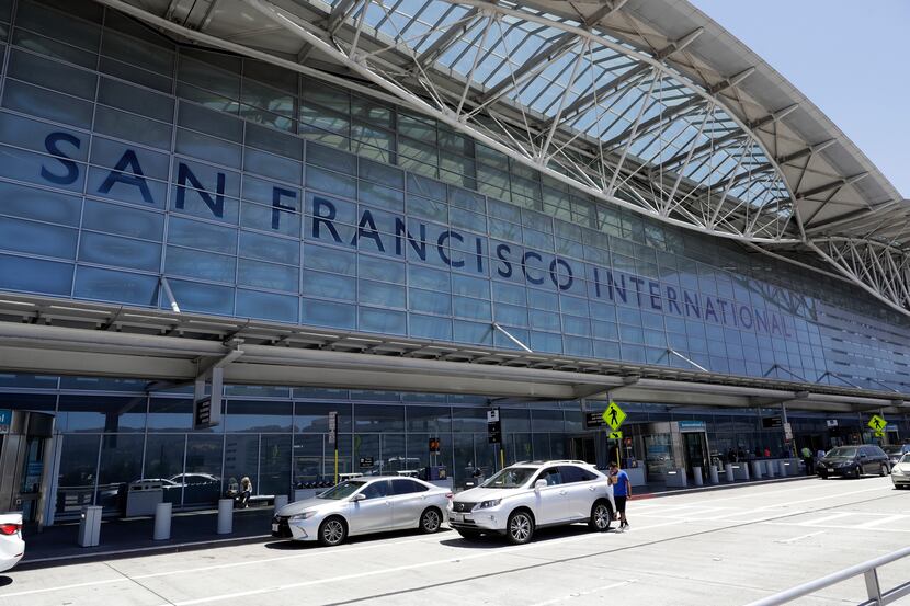 FILE - Vehicles wait outside the international terminal at San Francisco International...