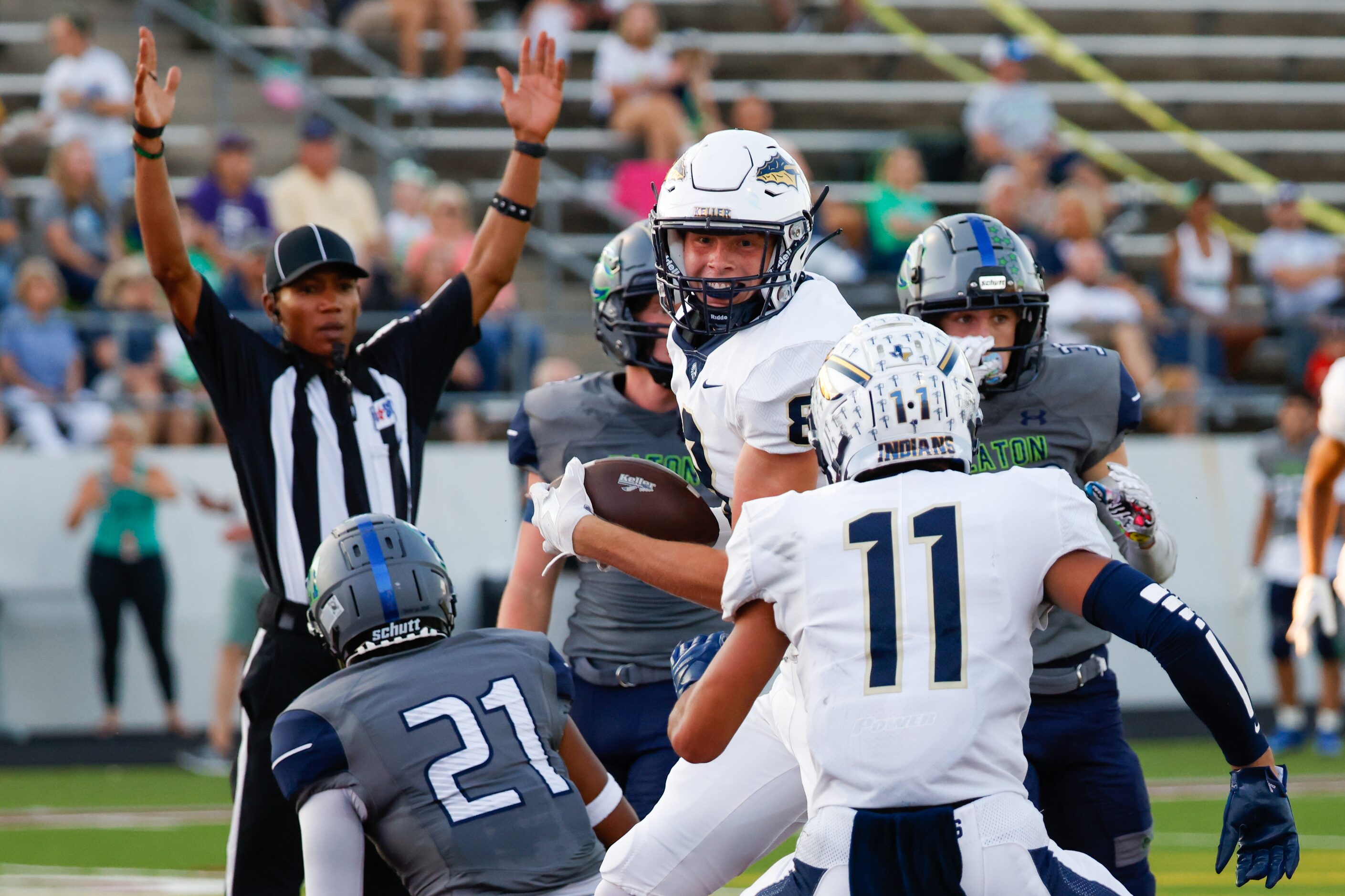 Keller High School wide receiver Parker Ireson (8) jumps up after scoring the first...